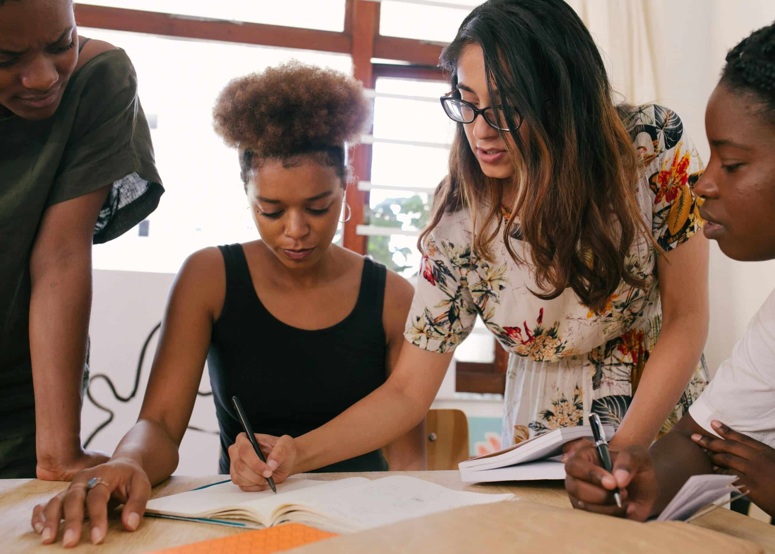 A group of women working together in an office settings.