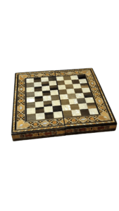 A handcrafted Barjis game board featuring an intricate geometric inlay design with a mix of wood and mother-of-pearl tiles. The board is foldable with detailed borders displaying traditional patterns.