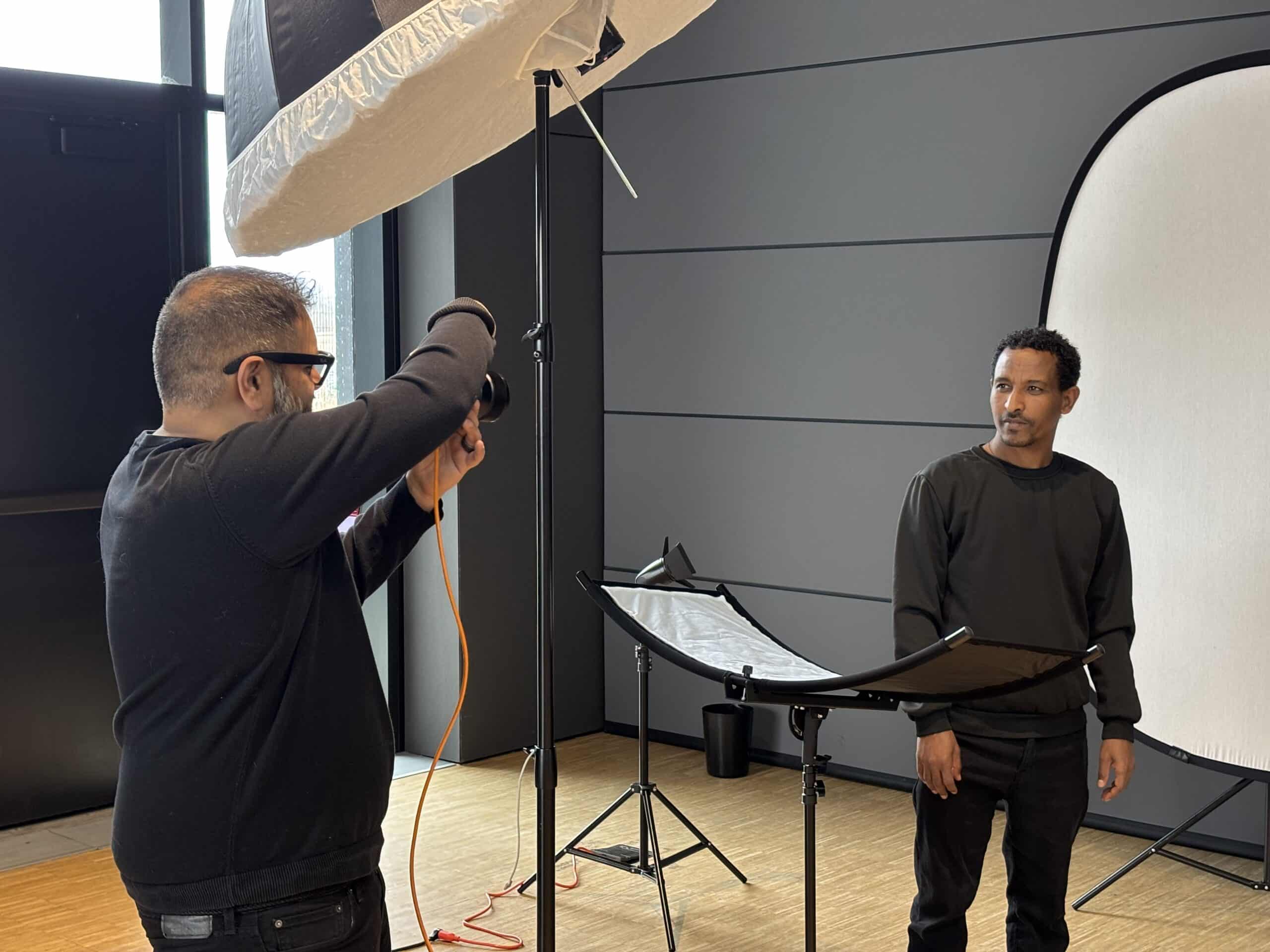 Job seeker having a professional headshot taken at the LinkedIn Photo Corner during the Jumpstart Refugee Hiring Event.