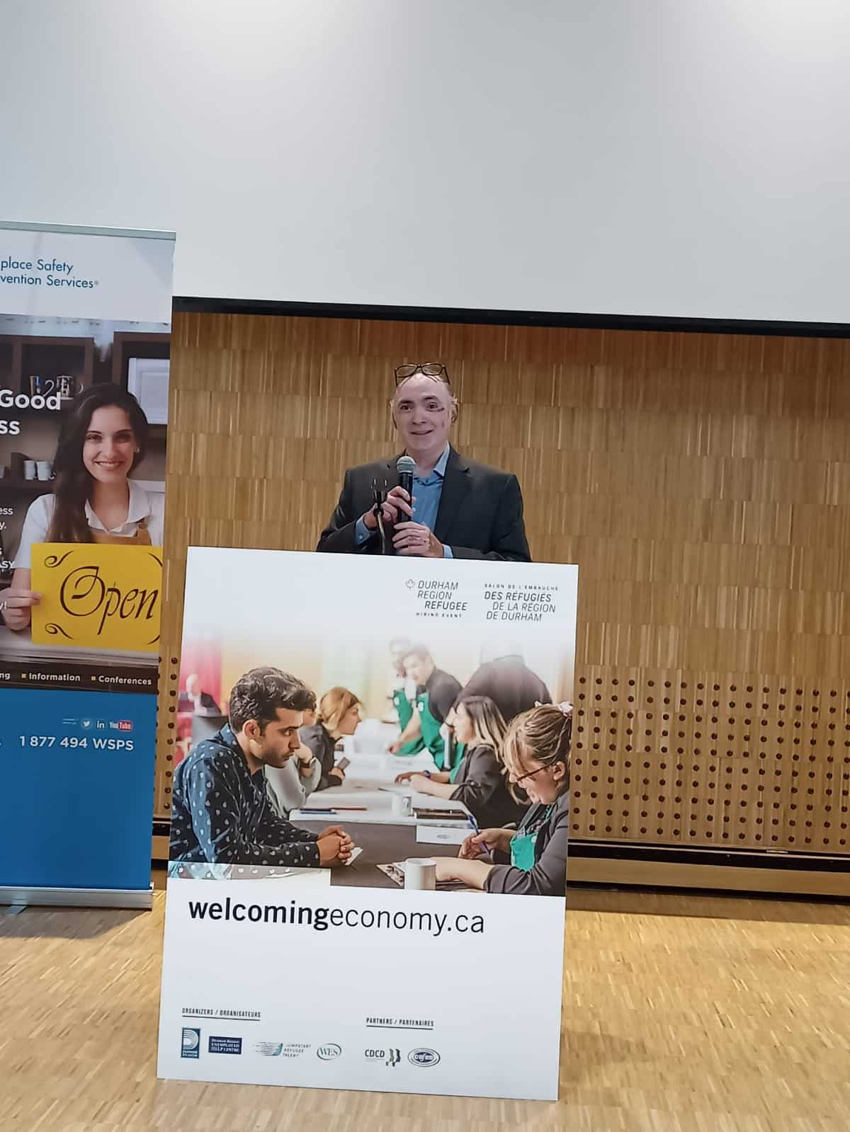 Darrell Pinto, Direct Employment Manager at Jumpstart, delivering a speech at the Durham Refugee Hiring Event.