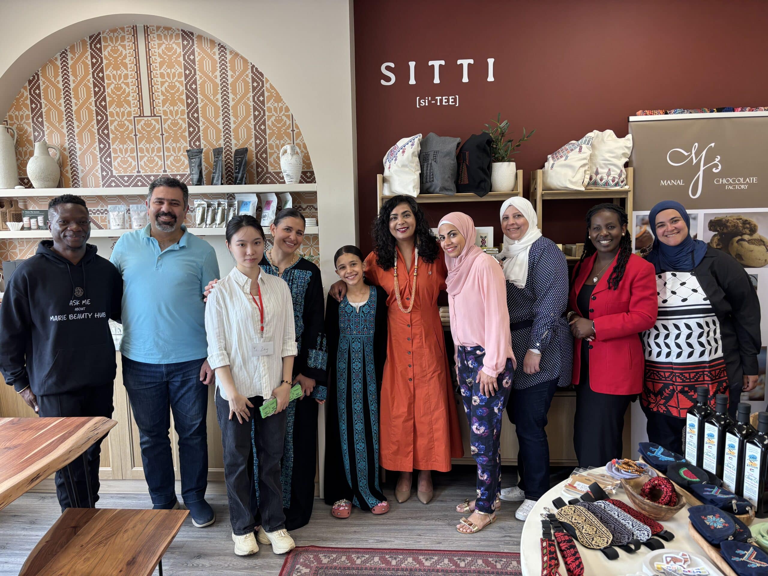 MP Iqra Khalid stands with refugee vendors and community leaders, including Marie Beauty, SITTI, Kahwe Time, Jumpstart, and Manal Chocolate team members, during the Refugee Marketplace event in Mississauga.