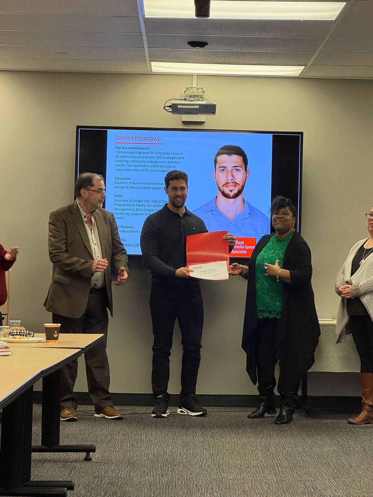 Yaseen receiving his certificate from Michelle Allen (ACCES Employment Program Manager) and Steven Little (Humber College Professor) for the Digital Marketing Bridging Program.
