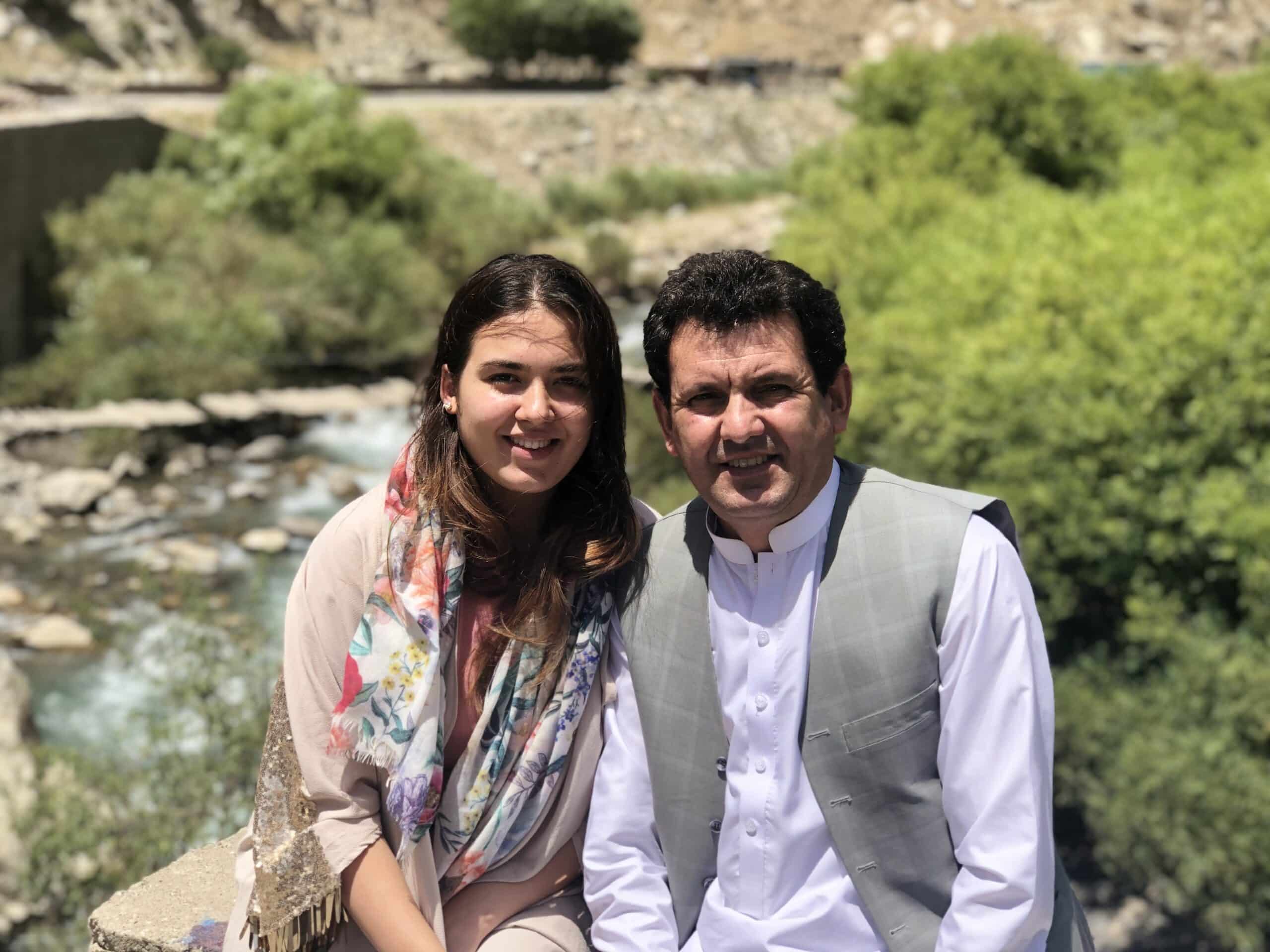 Wazhma next to her father in Afghanistan