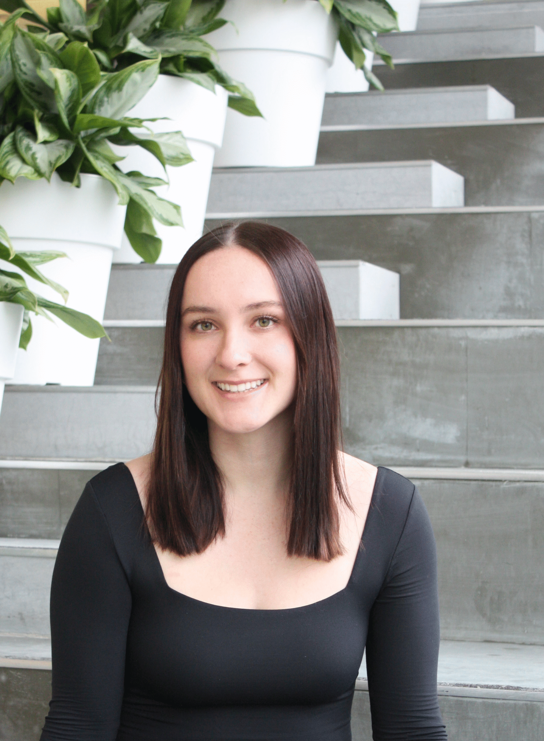 Alice Gales, Talent Assistant at Jumpstart Refugee Talent, smiling in a professional portrait.