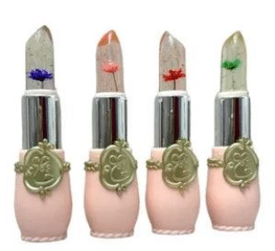 Four color-changing lipsticks with gold foil and embedded flower detailing arranged together.
